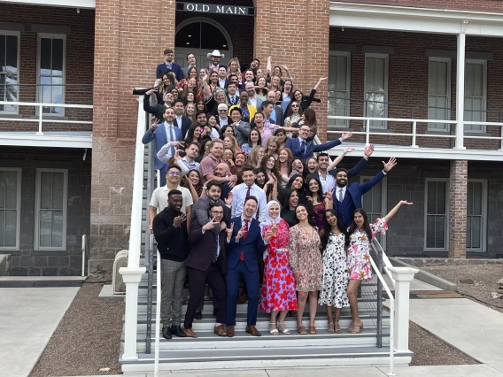 MedCats Class of 2024 pose on the steps of Old Main