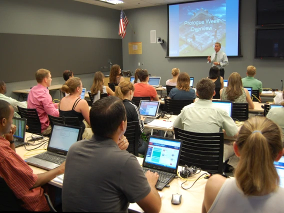 Professor teaching students in a classroom.