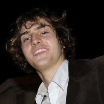 A professional headshot of a person.