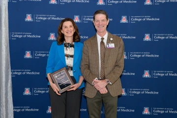Dr. Gothard with her award standing next to Dr. Moynahan