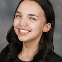 A professional headshot of a person.